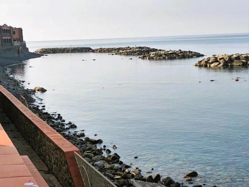 a body of water with a bunch of rocks in it at La Terrazza nel Mare in Acciaroli