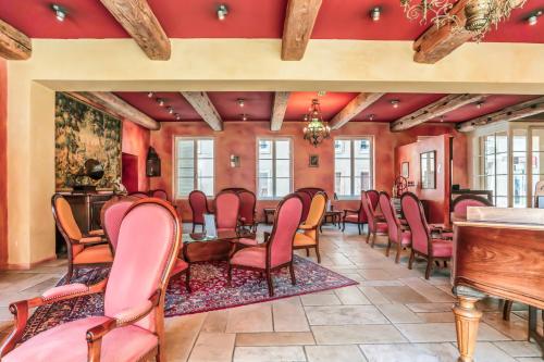 a room with a bunch of chairs and a table at Hôtel Du Théâtre Centre Historique - Parking Souterrain Public Gratuit in Metz