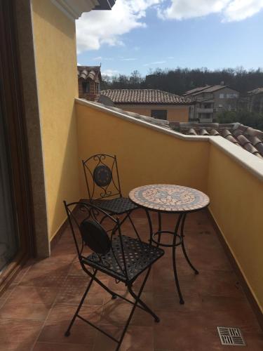 a balcony with a table and chairs and a view at Villa Eva Karigador in Novigrad Istria