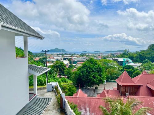 a view of a city from the balcony of a house at Hilltop Boutique Hotel in Victoria