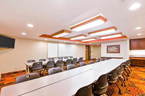 a large conference room with a long table and chairs at AmericInn by Wyndham Muscatine in Muscatine