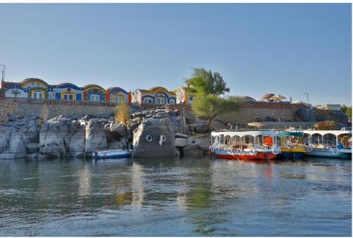 boats are docked in a harbor at Anakato Nubian Experience in Aswan