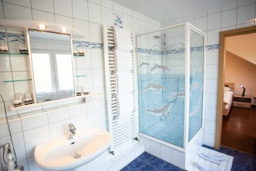 a bathroom with a sink and a shower at Hotel Am Sportpark in Duisburg