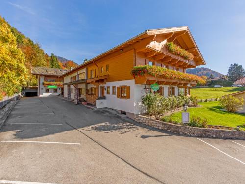 an empty parking lot in front of a building at Landhotel Gabriele in Unterwössen