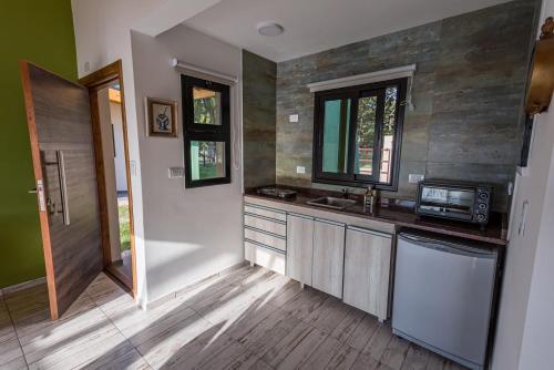 a kitchen with a sink and a counter top at La Matera Apart in Costa del Este