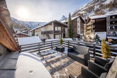 a balcony with a view of the mountains at Haus Genepy in Zermatt