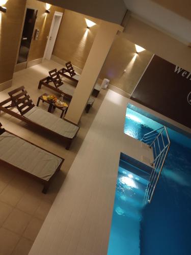 an overhead view of a swimming pool in a hotel room at STUDIO APARTMAN BAROSSA in Vinkovci