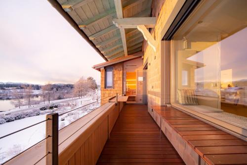 a balcony of a building with a view of the tracks at Lebensart am See in Bad Endorf