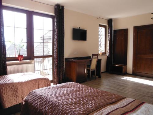 Postel nebo postele na pokoji v ubytování Willa Dąbrowa