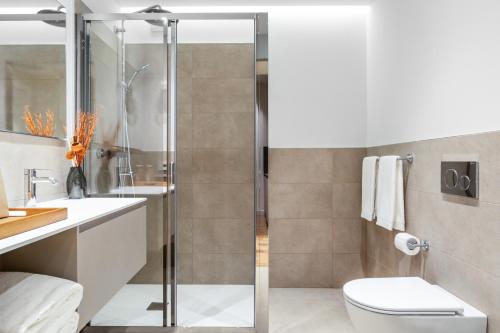 a bathroom with a shower and a toilet at CO99 Art Building Residence in Milan