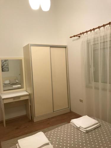 a white room with a mirror and a dressing table at JELSA center-Sea view apartment near the beach - B2 in Jelsa
