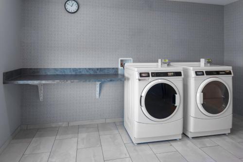 a laundry room with a washer and a dryer at Hyatt Place Charlotte University in Charlotte