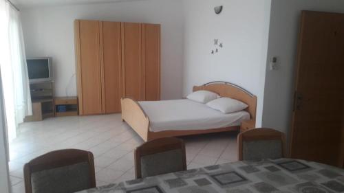 Postel nebo postele na pokoji v ubytování Apartments IVAN in Duce (900)