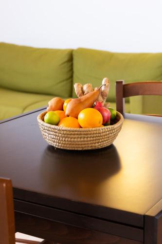 a bowl of fruits and vegetables on a table at Albergo Diffuso Polcenigo C. Zoldan in Polcenigo