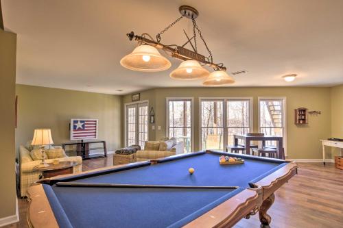 a living room with a pool table at Lavonia Lake House with Private Dock and Bonfire! in Lavonia