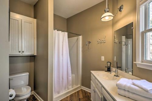 a bathroom with a shower and a toilet and a sink at Lavonia Lake House with Private Dock and Bonfire! in Lavonia
