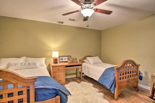 a bedroom with two beds and a ceiling fan at Lavonia Lake House with Private Dock and Bonfire! in Lavonia