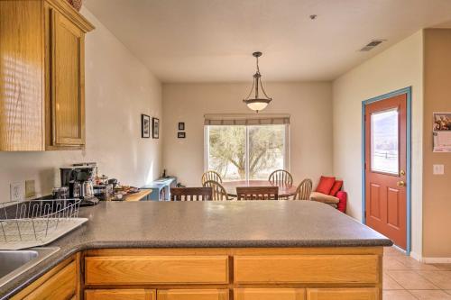 a kitchen with a counter and a dining room at Borrego Springs Stargazing Home with Mtn Views in Borrego Springs