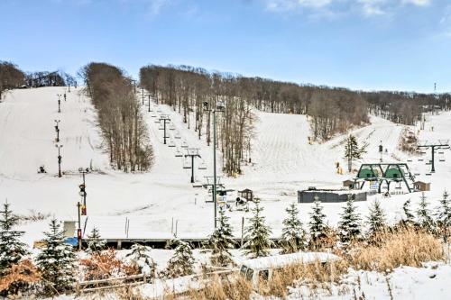 a snow covered ski slope with a ski lift at Idyllic Somerset Condo Ski, Hike and Relax! in Champion