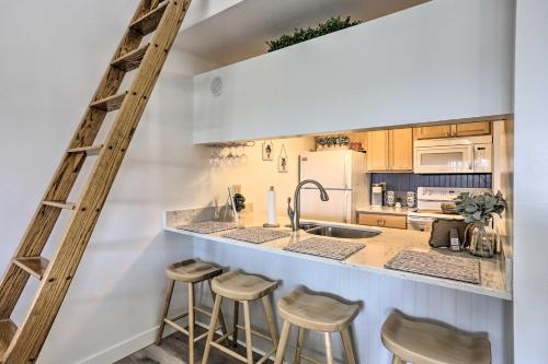 A kitchen or kitchenette at Modern-Boho Condo with Waterfront Balcony, Pool