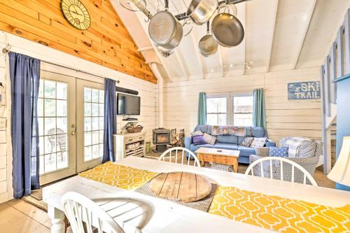a living room with a couch and a table at Private Lake Access and Canoes Pennsylvania Cottage in Lakewood