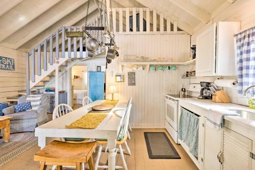 a kitchen and dining room with a table and chairs at Private Lake Access and Canoes Pennsylvania Cottage in Lakewood