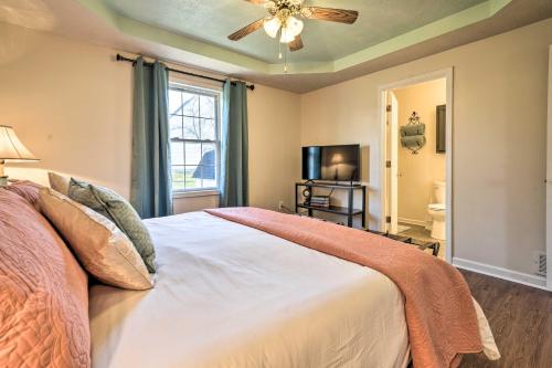 a bedroom with a bed and a ceiling fan at Quiet Somerset Retreat - Near Lake Cumberland in Somerset