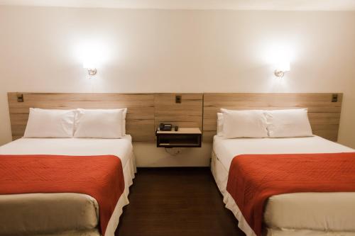 Una cama o camas en una habitación de Hotel Marina