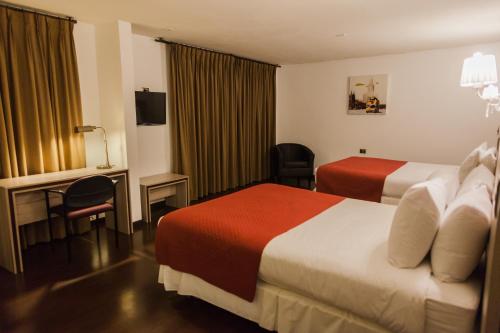 Ένα ή περισσότερα κρεβάτια σε δωμάτιο στο Hotel Marina