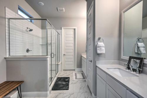 a white bathroom with a sink and a shower at Patio and Game Room Modern Home in Frisco in Frisco