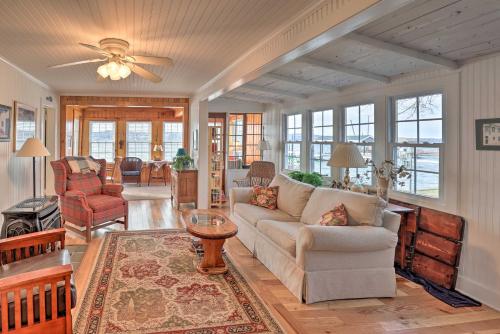 a living room with a couch and a table at Lakefront Canandaigua Home with Grill, Fire Pit in Canandaigua