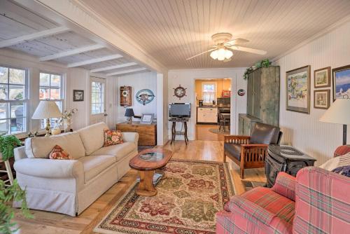 a living room with a couch and a table at Lakefront Canandaigua Home with Grill, Fire Pit in Canandaigua