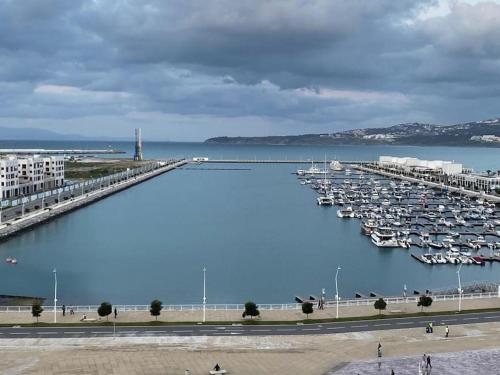 a harbor filled with lots of boats in the water at Panoramic Sea View Apartment 1 Min Walk to Beach in Tangier