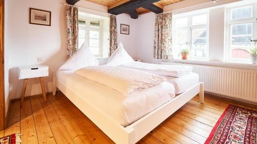 Postel nebo postele na pokoji v ubytování Appartementhotel Blomberger Hof