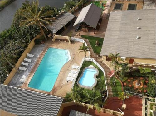 an overhead view of a swimming pool in a house at 104 Santana Resort, Margate Beach in Margate