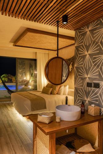 Ένα ή περισσότερα κρεβάτια σε δωμάτιο στο Xkan Hotel Boutique - Adults Only