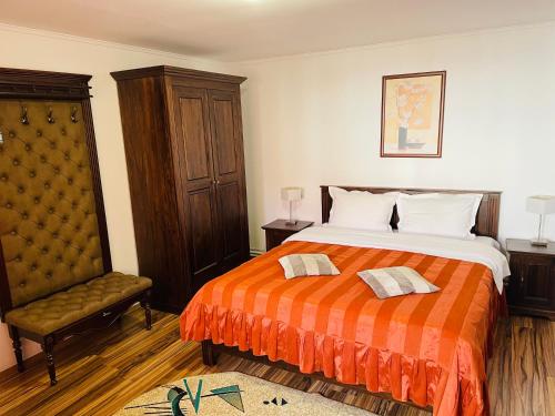 Giường trong phòng chung tại Casa Dudu