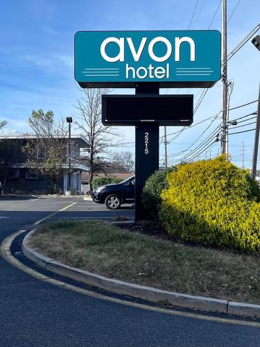 a sign for an oxon hotel on the side of a street at Avon Hotel - Toms River in Toms River