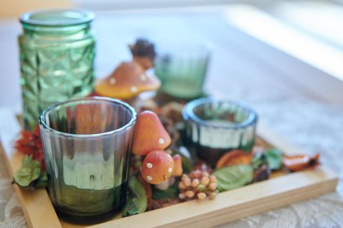a tray of food with three glasses on a table at Gemütliche Ferienwohnung in ländlicher Lage in Riesa