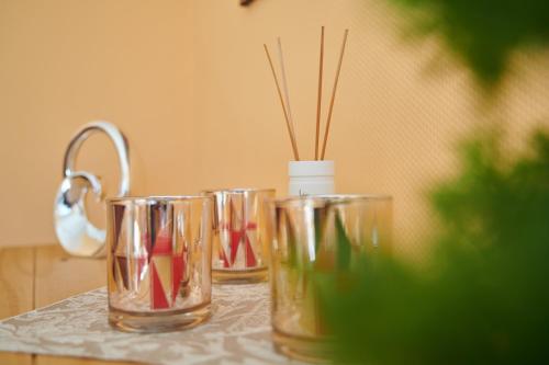 three empty glasses sitting on a table at Gemütliche Ferienwohnung in ländlicher Lage in Riesa