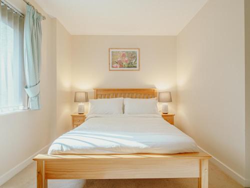a bedroom with a bed and two night stands at Jyde Apartments - Sheffield City Centre in Sheffield