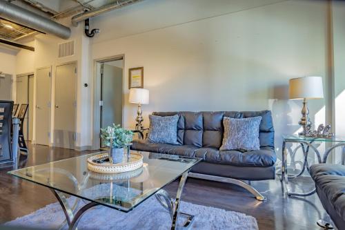 a living room with a couch and a glass table at Midtown 1BR Fully Furnished Apartment - Great Location! apts in Atlanta