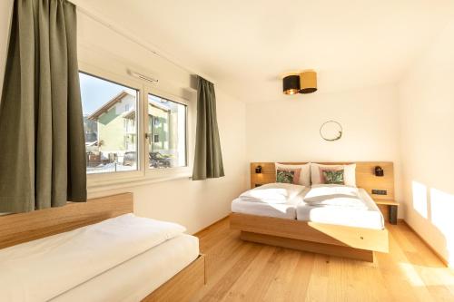 Posteľ alebo postele v izbe v ubytovaní LISAL Appartements