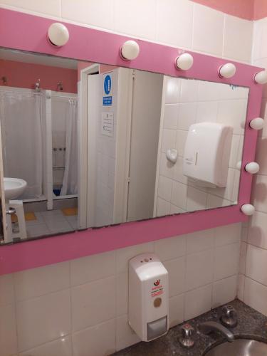 a bathroom with a mirror and a sink at BA Stop Hotel House in Buenos Aires