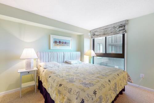 a bedroom with a bed and a window at Sea Colony -- 112 Georgetowne in Bethany Beach