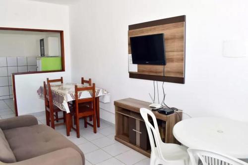 Un televizor și/sau centru de divertisment la Condominio Oliveira
