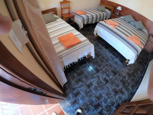 an overhead view of a bedroom with two beds at Hotel AATRAC Iguazú in Puerto Iguazú