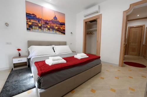 a bedroom with a bed with two towels on it at La Casa degli Osti 2 - Piazza Navona in Rome