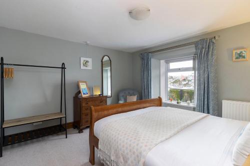 Llit o llits en una habitació de Dolphin Cottage
