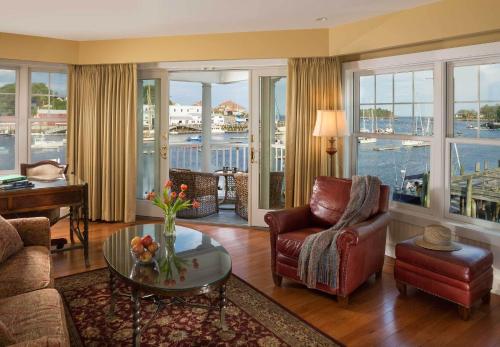 a living room with a view of the water at Grand Harbor Inn in Camden